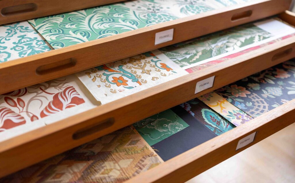 Hand painted flower pictures in David Walters archive drawers