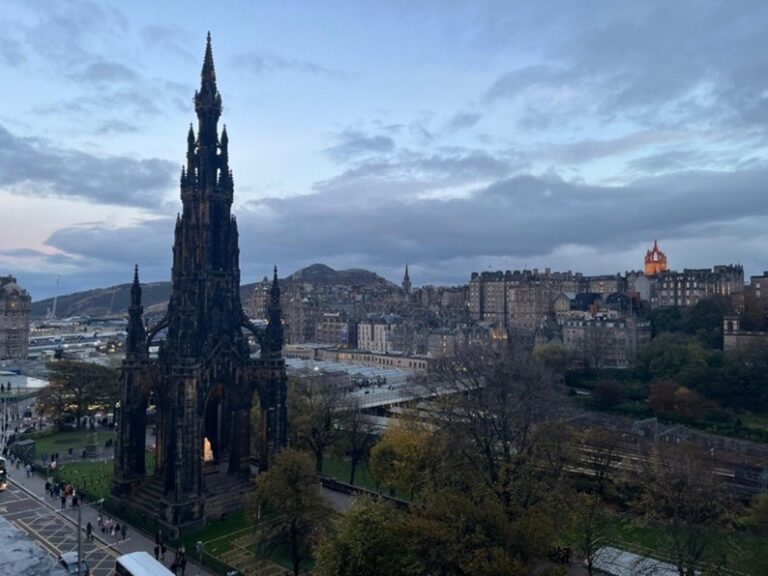 Edinburgh at night overlooking train station