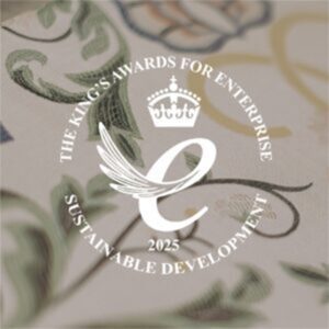 Kings award for enterprise, sustainable development logo over silk fabric