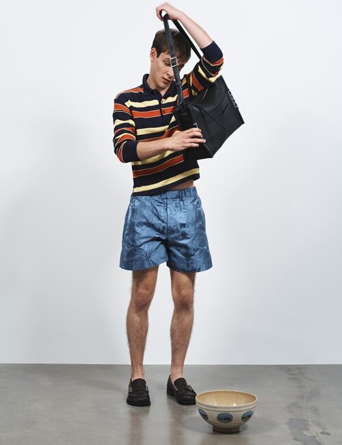 Blue Silk Damask Shorts with male model with handbag and ceramic pot