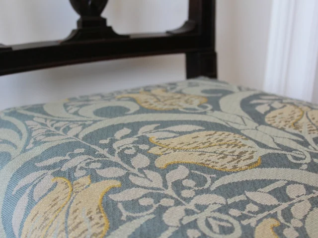 Our heavyweight Jacquard upholstery fabric, shown here in a variety of striking colourways, is woven in what we refer to as a tapestry-style construction. This particular quality combines cotton and wool for a rich, tactile finish, ideal for statement upholstery and curtains.

Inspired by Art Nouveau influences, the design blends organic motifs with bold structure. Originally created for a private home, it demonstrates how our traditional weaving methods can bring contemporary visions to life.

We often reimagine archive patterns or develop new designs from original artworks and client briefs. If you’re looking for something truly bespoke, our specialist team is here to help.

#ArtNouveau #JacquardUpholstery #TapestryWeave #CottonAndWool #InteriorTextiles #CustomWeaving #HeritageMeetsModern #BritishCraftsmanship #WovenInSudbury #BespokeFabricDesign